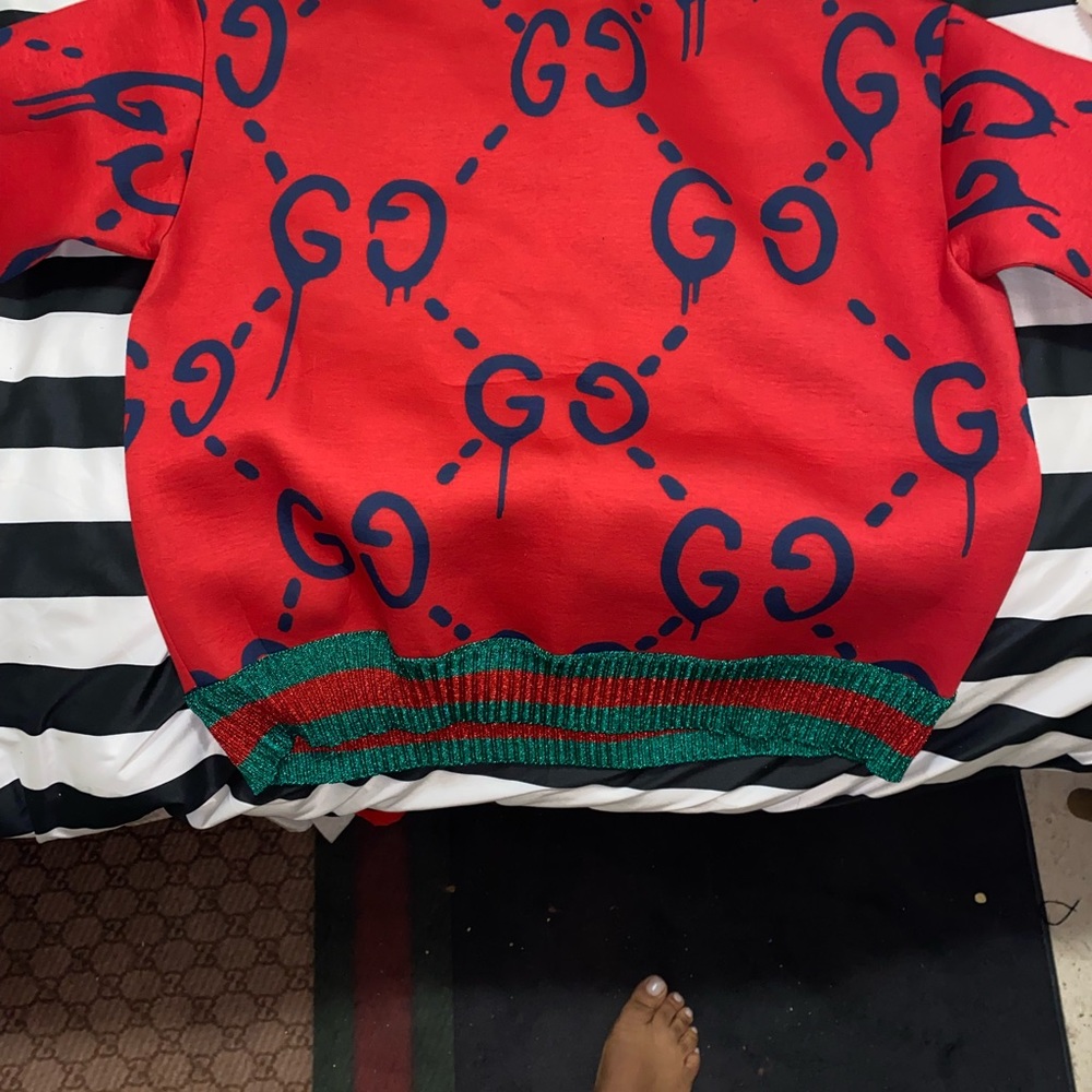 This amazing authentic Gucci sweater from the ghost collection